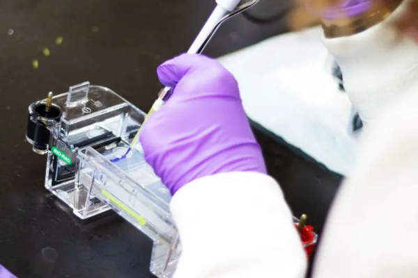 A student performing experiment in a lab.