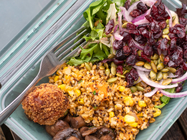 an assortment of plant based items in a green container