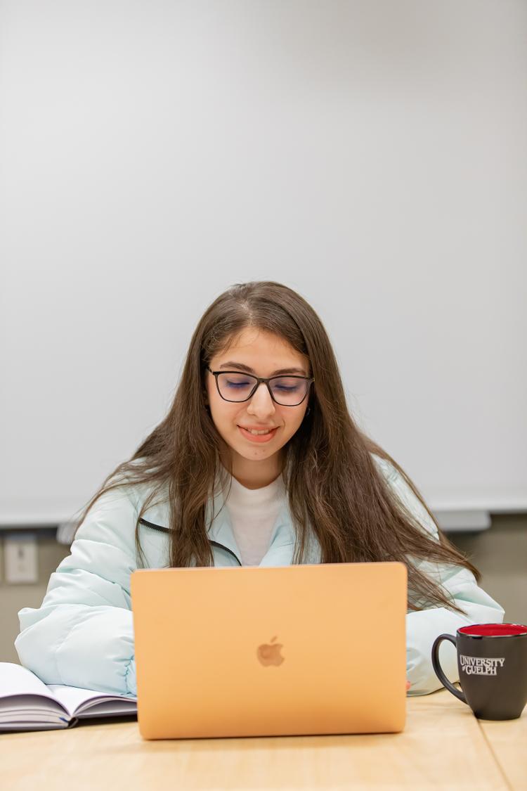 person works on a laptop computer