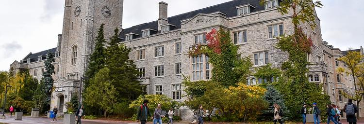 Students walking outside in front of Johnston Hall.