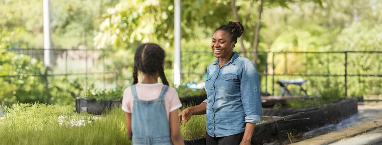 A grad student working in a community garden