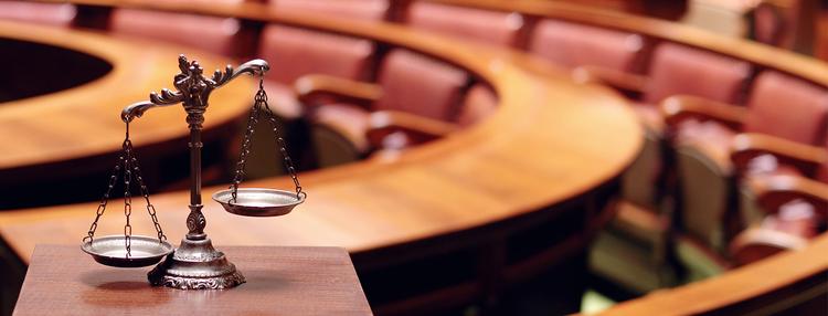 scales of justice in a courtroom