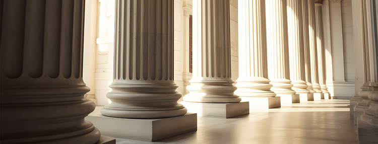 Columns line an institutional hallway