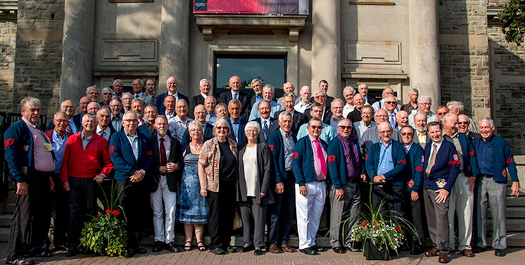 a photo of a class reunion in front of creelman hall