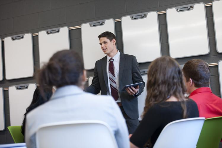 Man giving presentation to group of employees