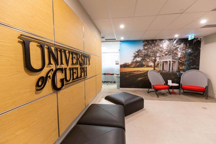 MCTI lobby with chairs, couches, and U of G sign and mural