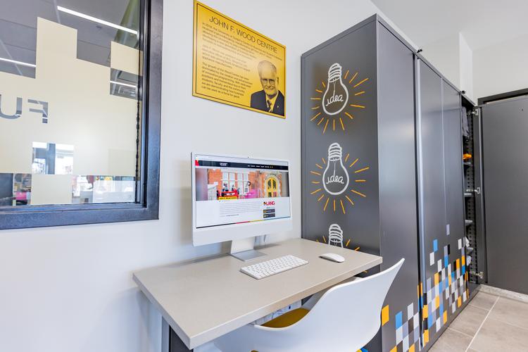 A picture of a desk with a computer