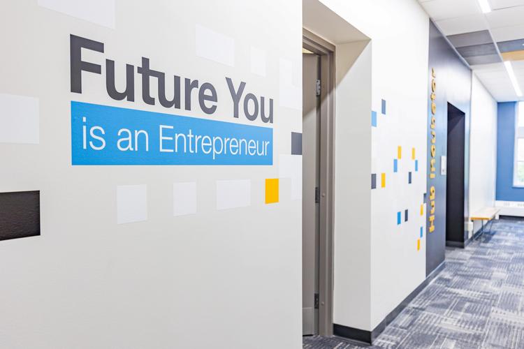 Future You Is an Entrepreneur text on a wall