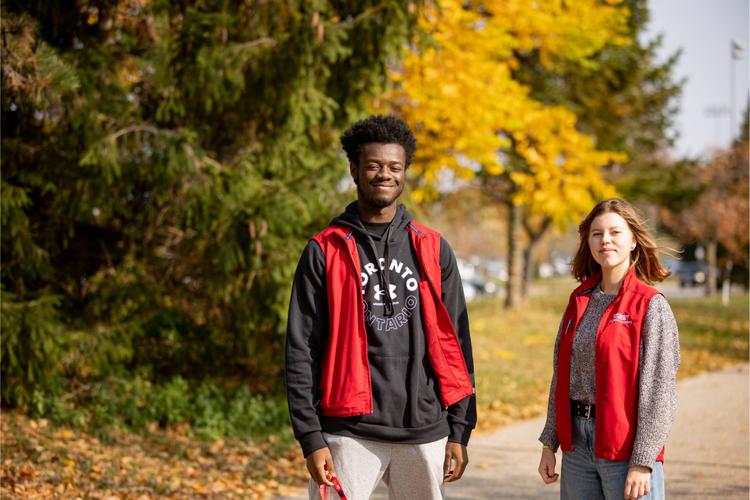 Two students in the RLS vest