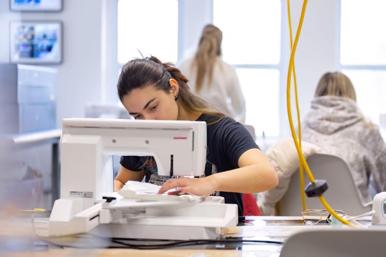 Student using embroidery machine