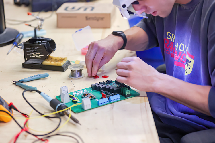 student working on a microchip