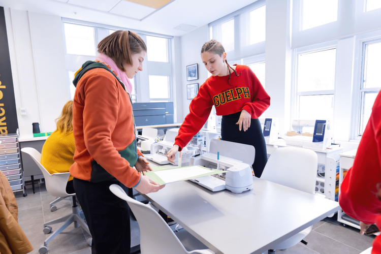 two students using Cricut machine
