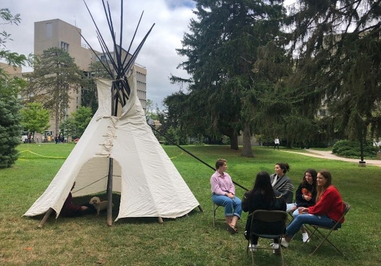 Students with tipi on johnston green