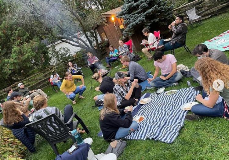 Students and staff having a bbq