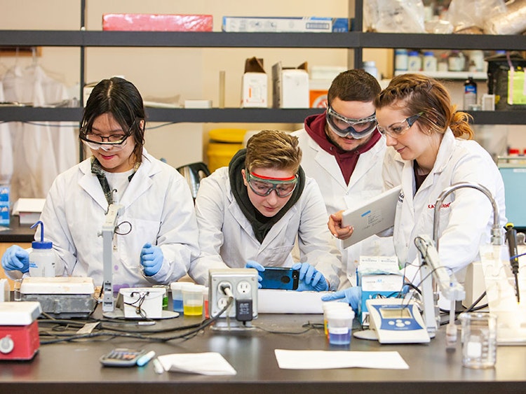 Four University of Guelph students in a lab on campus