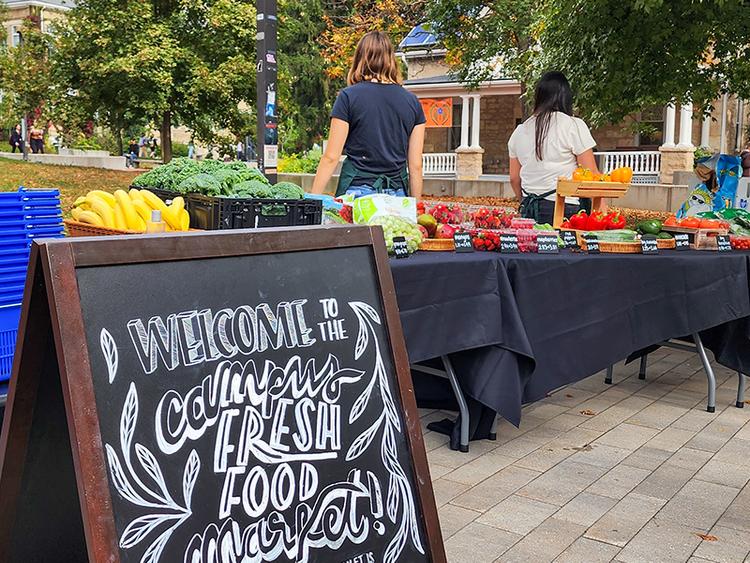 Signboard reading "Welcome to Campus Fresh Food Market"