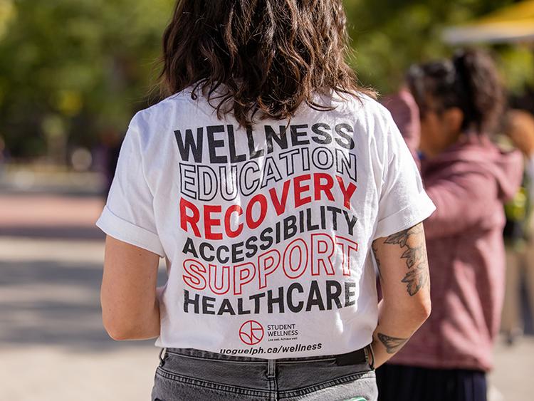 Student wearing wellness shirt
