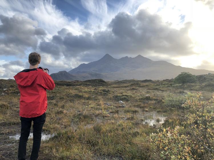 Student with camera in field