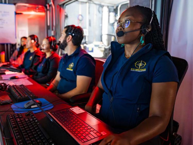 Moronke Harris sitting in the command centre of a deep sea dive.