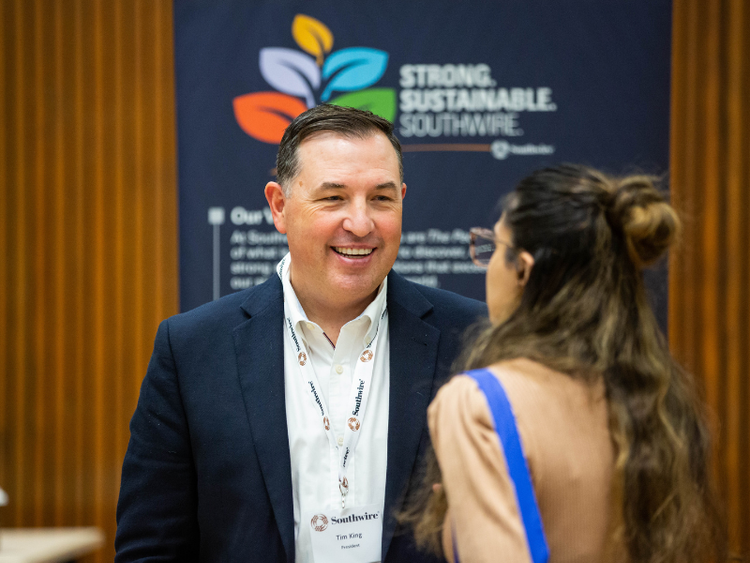 Employer talking to a student.