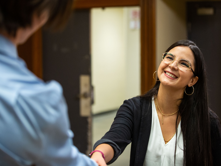 Two people shaking hands.