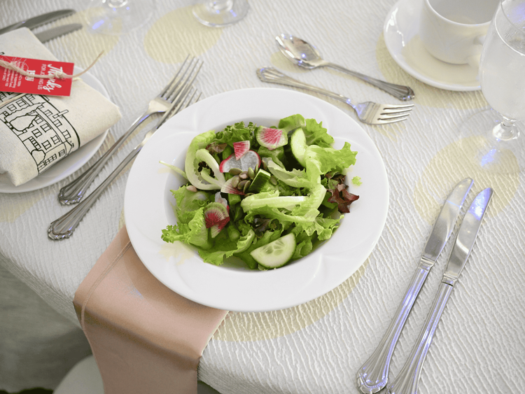 Salad on table with cutlery