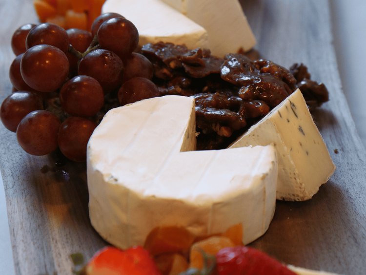 cheese board with grapes