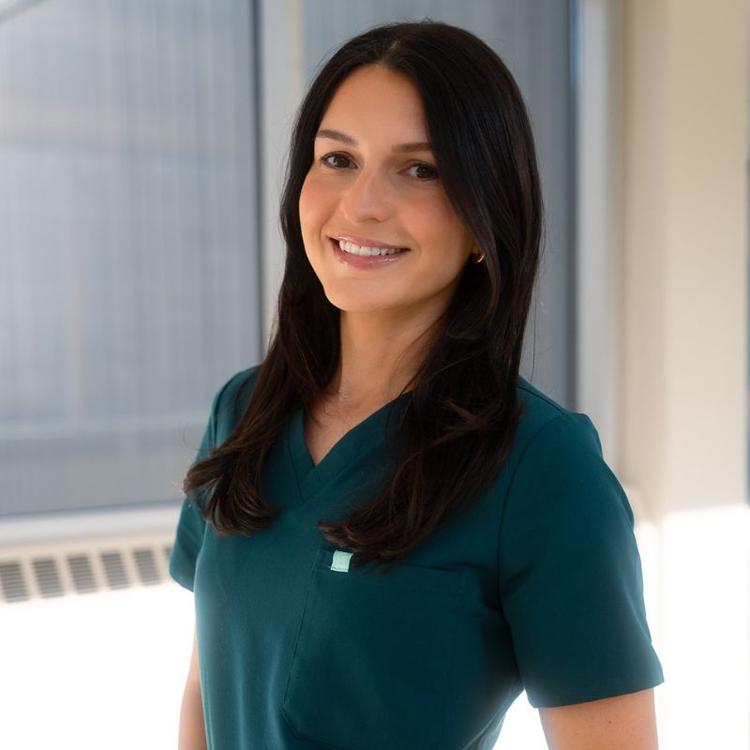 Guelph Grad Laurel McGillis in med school wearing scrubs.