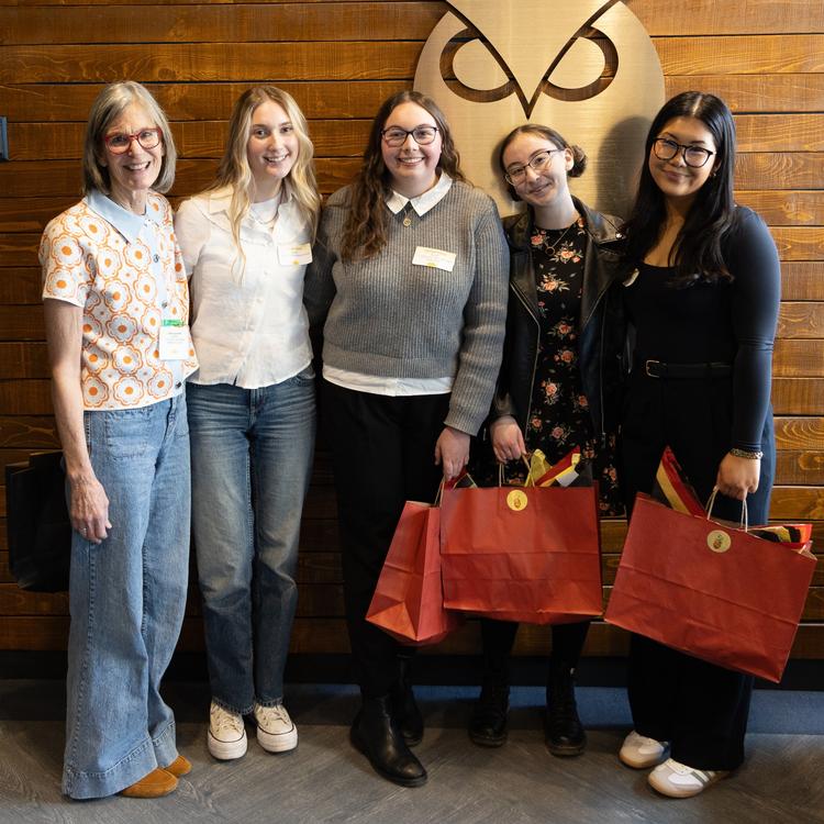 Award winners pose with gift bags in the lobby of The Lookout
