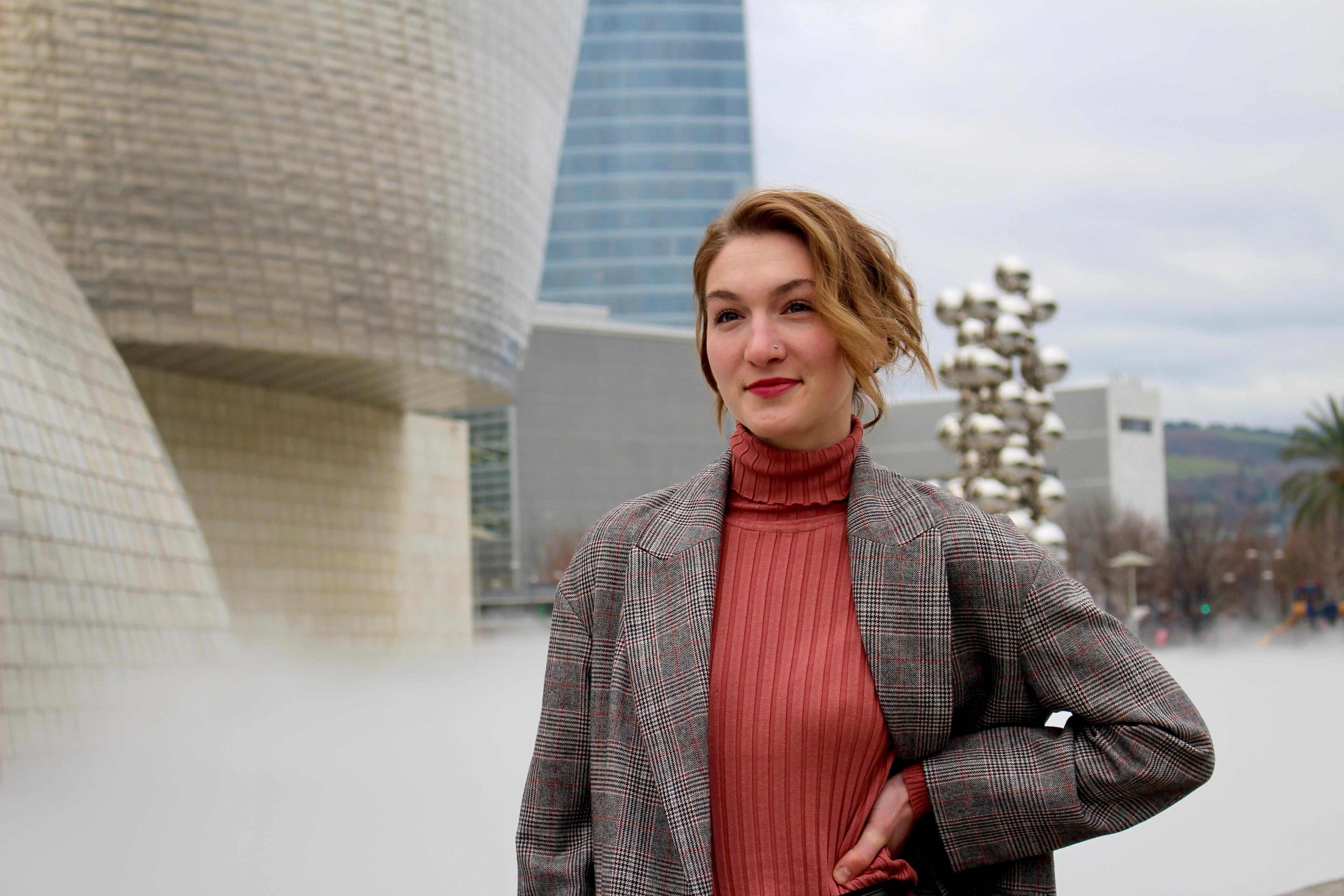 OVC PhD graduate Alex Sawatsky is shown standing outside a building.