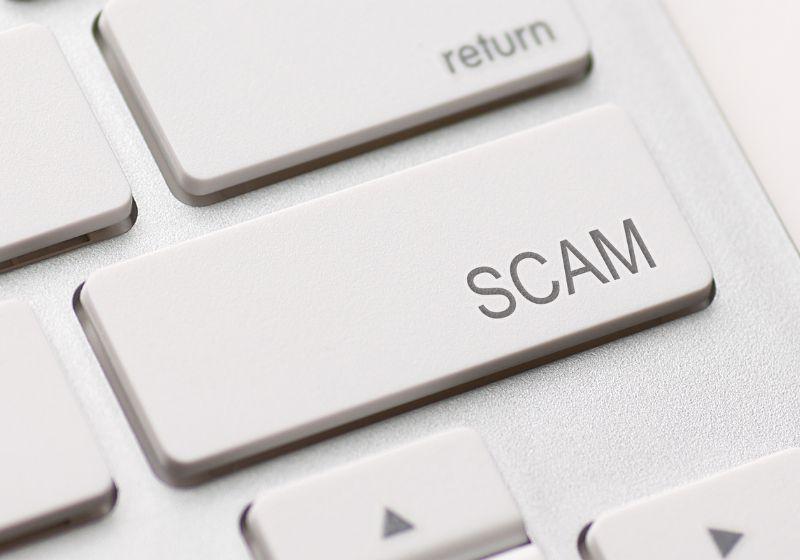 Enter key that says 'scam'