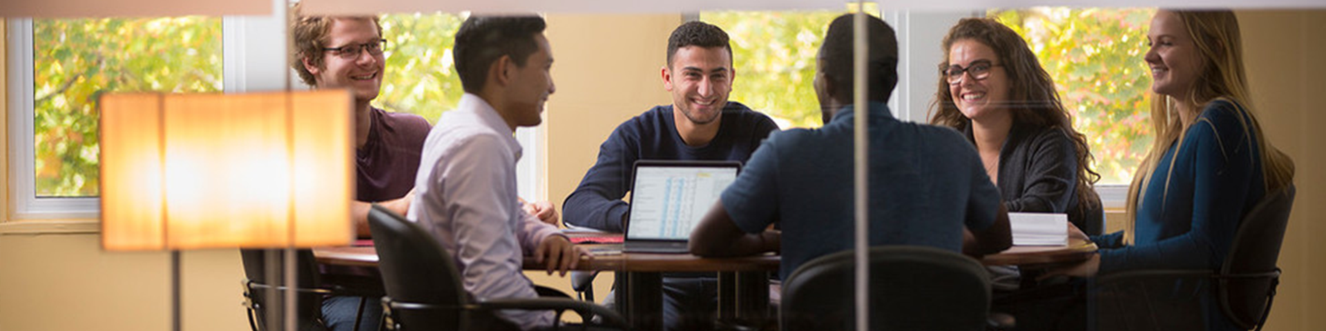 business students working together in a meeting room