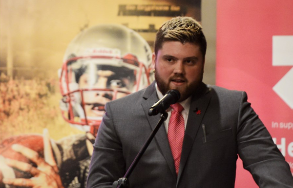 football player speaking at event