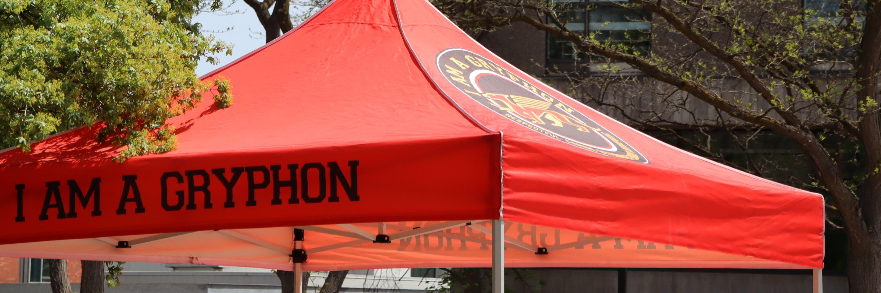 Red tent with text that says I Am A Gryphon