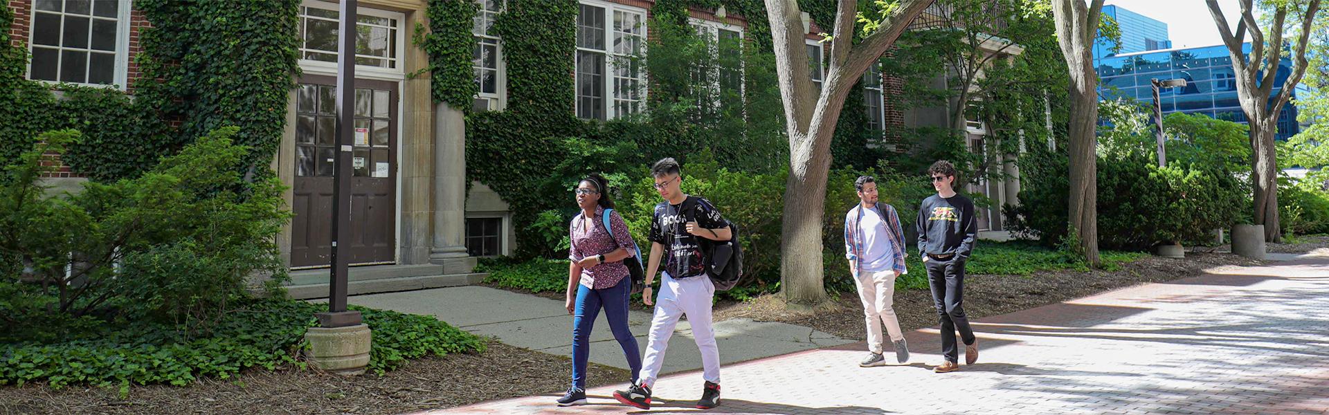University of Guelph students walking outside of the Hutt building