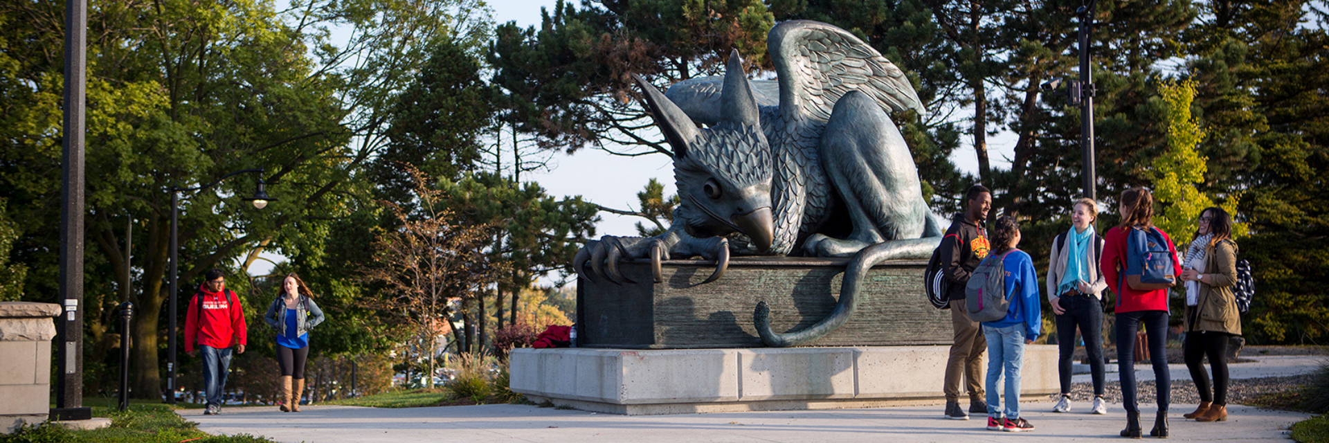 Students at the Gryphon Statue