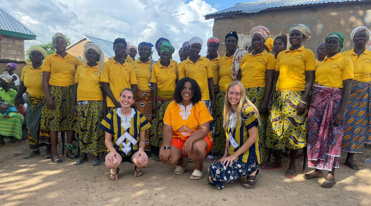 Left to Right: Volunteers Sandra Nyman (OVC 2026), Dr. Keisha Harris (OVC 2023) and Marley Blok (UBC 2023) pictured with the Yua Womens Group during a goodbye ceremony hosted by the Yua community. In the picture we are wearing traditional smocks crafted by local weavers and sewers and gifted to us a thank you for the work we did in the community. 