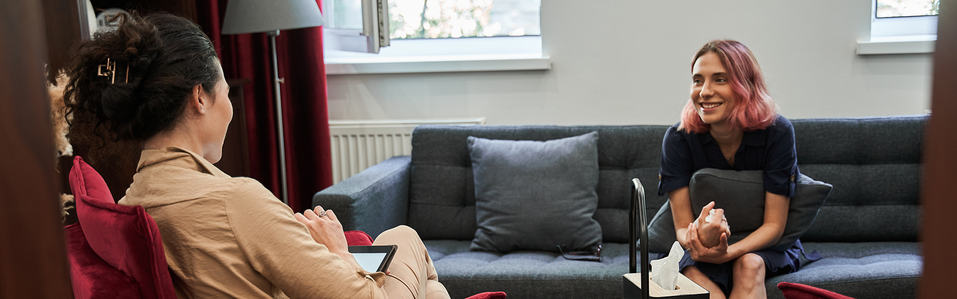 A therapist counsels a client