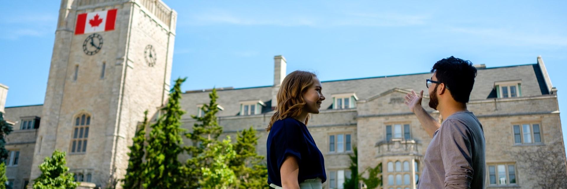 two people talking outside Johnston Hall