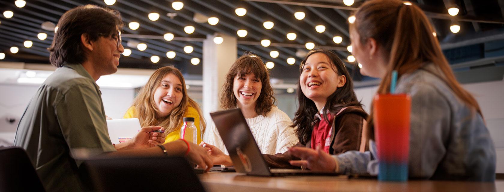 University of Guelph transfer students chatting and laughing together