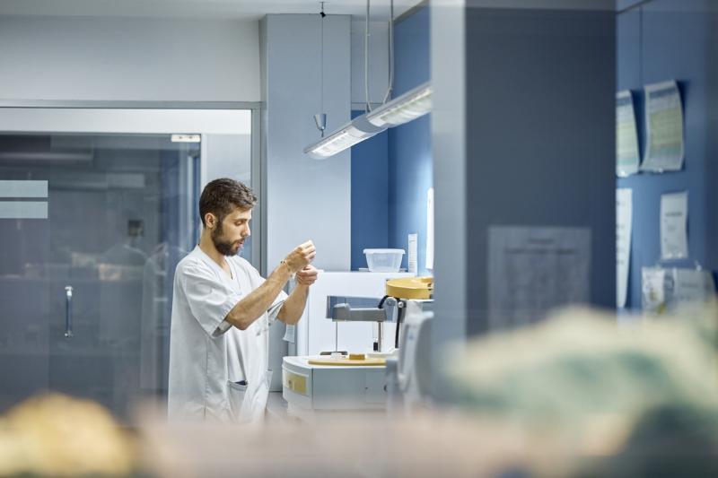 male laboratory technician conducting chemical analysis