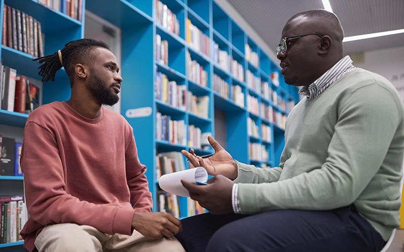 student speaking with therapist