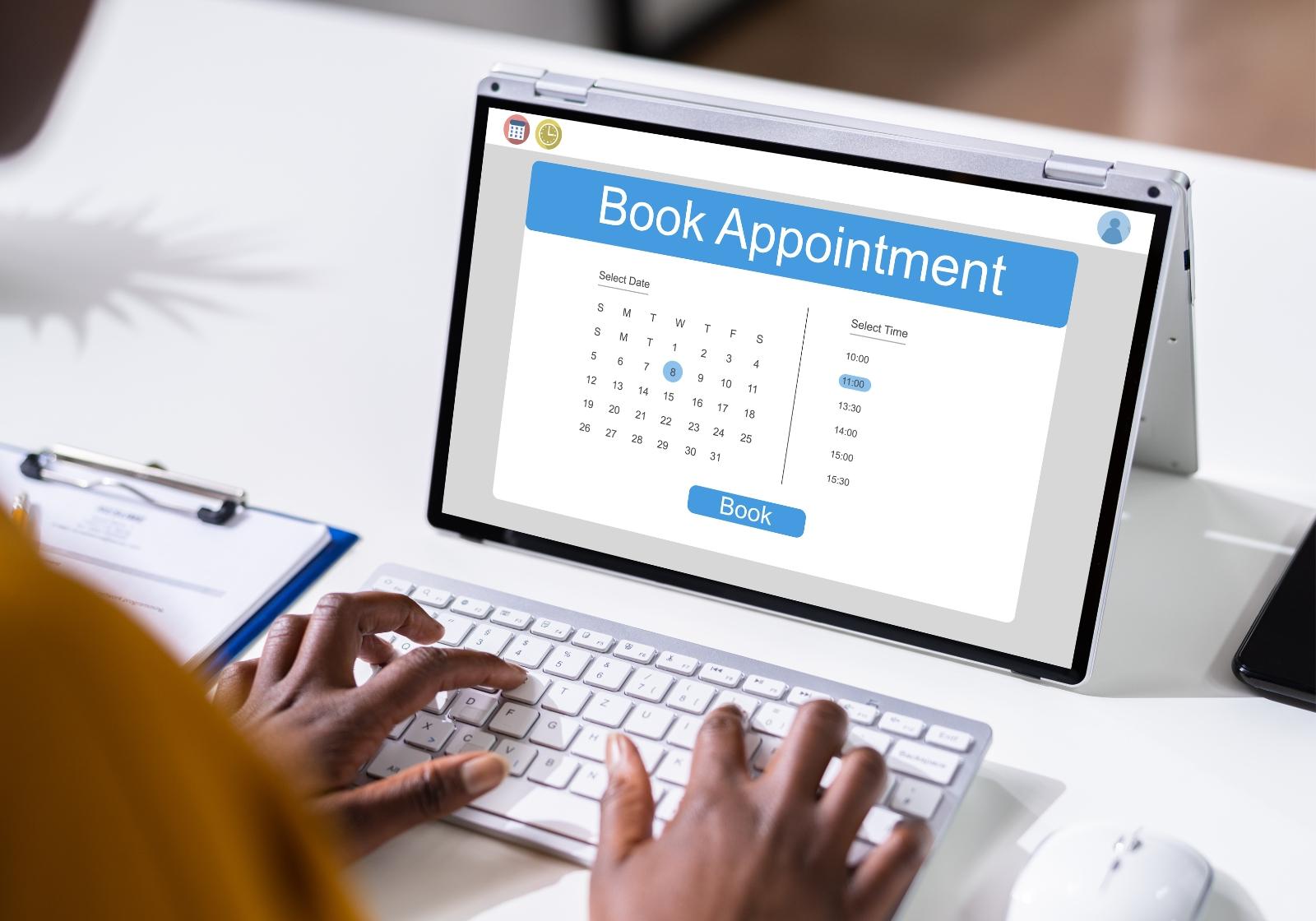Tablet with "Book Appointment" on screen