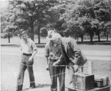 Black and white image of Professor Blackwood Demonstrating Electric Fencing ca. 1940