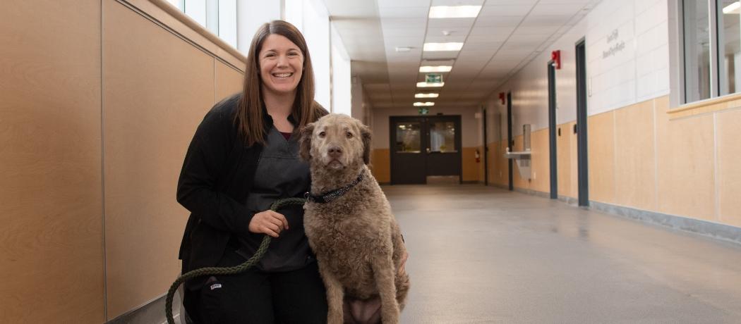 Pamela Longworth, an RVT at OVC, poses with her dog Roxie.