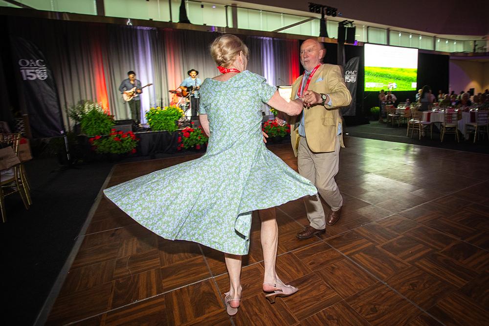 A man and woman dancing on a dance floor.