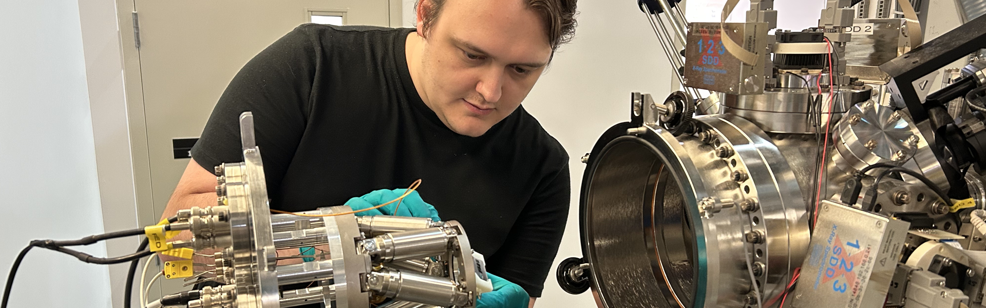 Researcher working on a piece of equipment