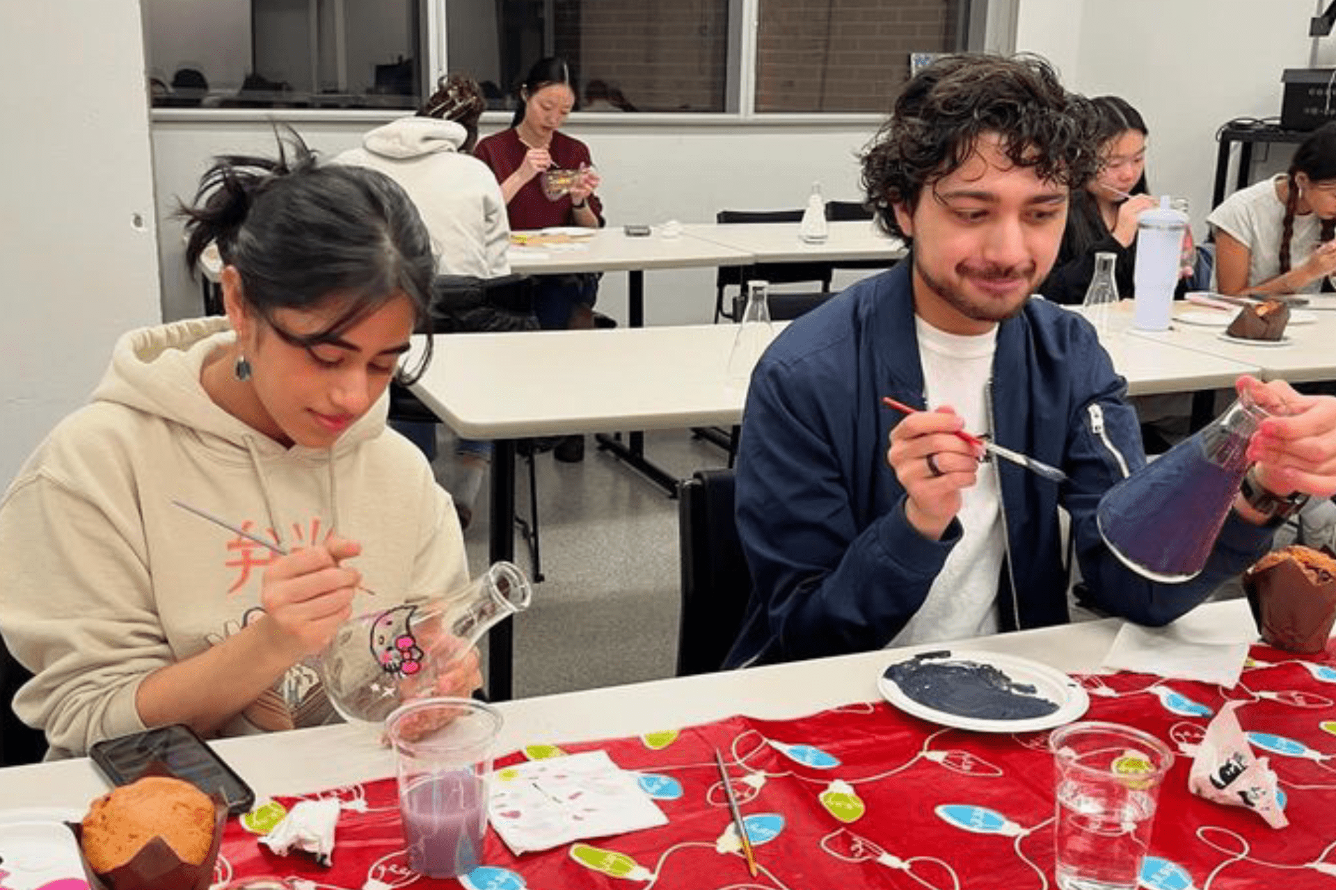 Toxicology Student Association members painting instruments