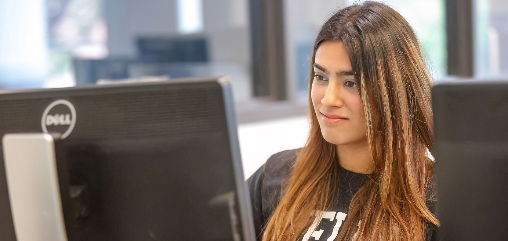 A student works on a computer at U of Guelph.
