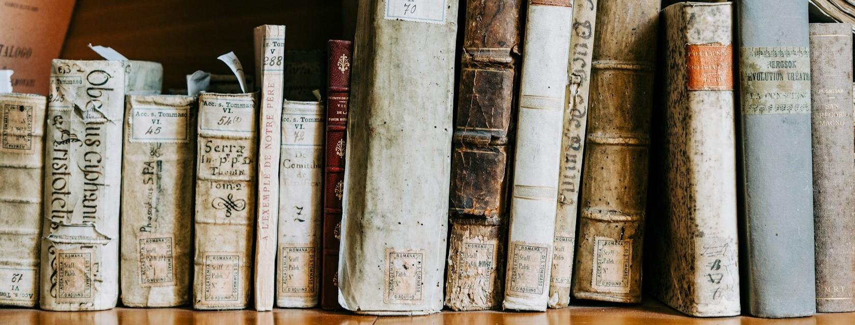 A bookshelf full of antique books